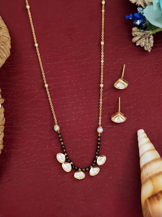 Festive Kundan Jewellery High Gold Polish Celebrate in Style Pendent Set