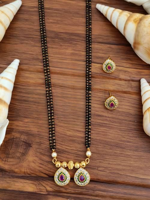 Kemp Matte Gold Polish Full Stone Long Party wear Ruby Green White Pendent Set